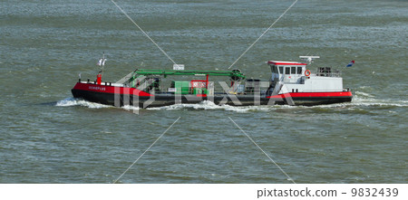 Small chemical tanker sailing in the port of Rotterdam (Holland) Small chemical tanker sailing in the port of Rotterdam (Holland) 9832439