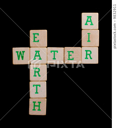 Green letters on old wooden blocks (earth, water, air) 9832911