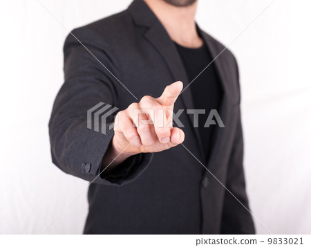 Businessman pressing an imaginary button 9833021
