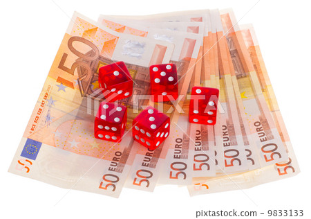 Red dice on top of some 50 euro banknotes 9833133