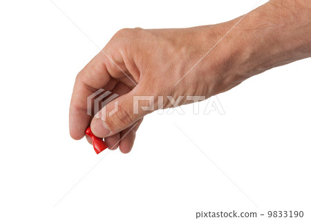 Hand holding a red pawn Hand holding a red pawn 9833190