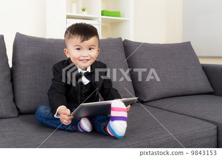 Little boy using tablet Little boy using tablet 9843153