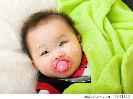 Asian baby with pacifier Asian baby with pacifier 9843223