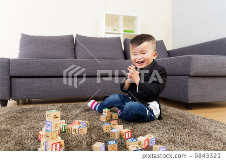 Asian kid playing toy block Asian kid playing toy block 9843321