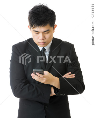 Businessman using mobile 9843515