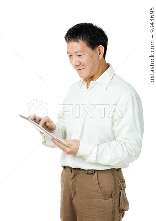 Asian senior man using tablet 9843695