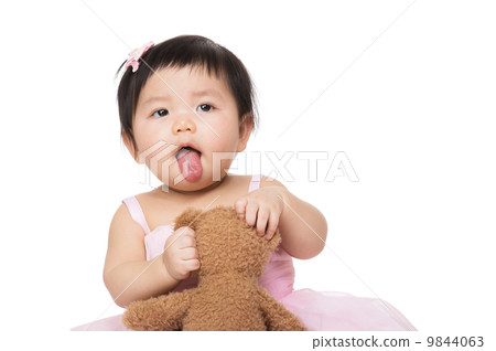 Baby girl shows tongue 9844063