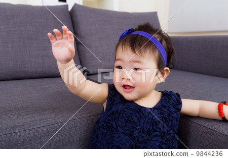 Baby girl waving hand 9844236