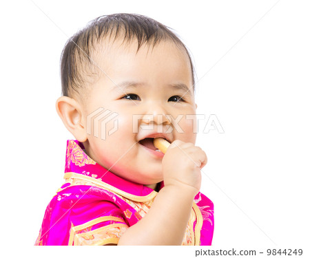 Chinese baby eating biscuit 9844249