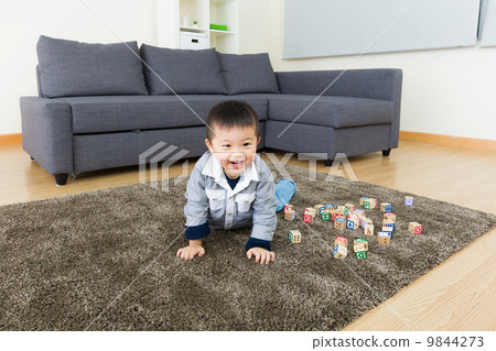 Little boy creeping at home 9844273