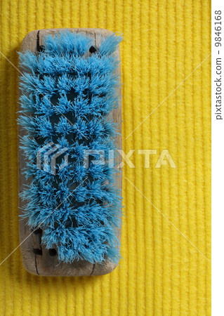 yellow sponge background and old brush 9846168