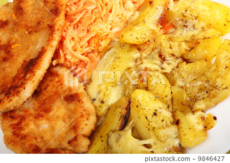 Fried chicken roasted potatos and carrot salad Fried chicken roasted potatos and carrot salad 9846427