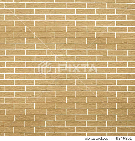 Closeup of yellow brick wall as background or texture 9846891