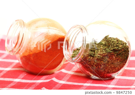 jars with spices paprika and lovage isolated jars with spices paprika and lovage isolated 9847250