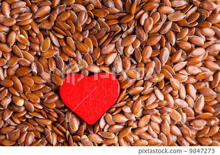 Healthy diet. Flax seeds linseed as food background and red heart Healthy diet. Flax seeds linseed as food background and red heart 9847273