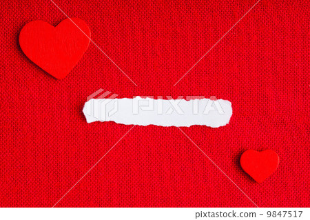 Piece paper blank copyspace hearts on red fabric textile material 9847517