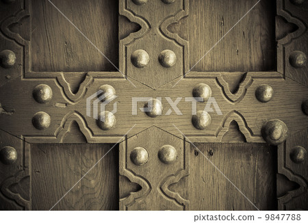 Old wooden background with metal rivets vintage door detail Old wooden background with metal rivets vintage door detail 9847788