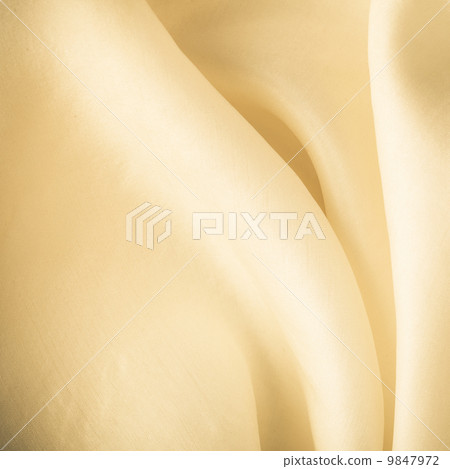 Gold background abstract cloth wavy folds of textile texture Gold background abstract cloth wavy folds of textile texture 9847972