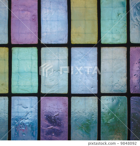 colored stained glass window with regular block pattern blue green tone colored stained glass window with regular block pattern blue green tone 9848092
