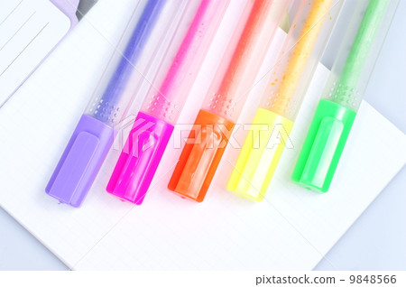 Colorful markers over a white background. 9848566