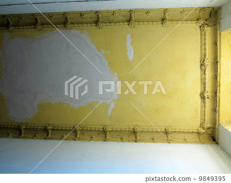 Damaged ceiling in an old abandoned home 9849395