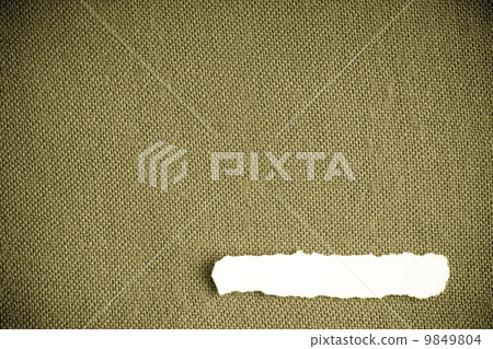 Piece paper blank copy space on brownish green fabric textile 9849804