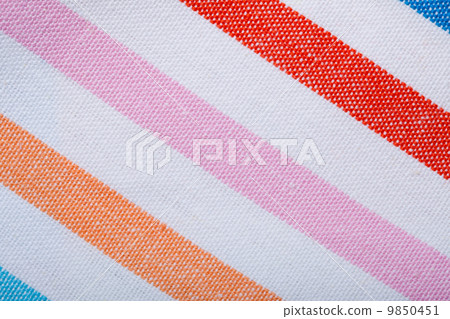 Closeup of colorful striped textile as background or texture Closeup of colorful striped textile as background or texture 9850451