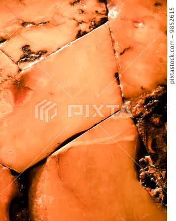 Closeup of golden amber as background or texture. Resin gem. 9852615