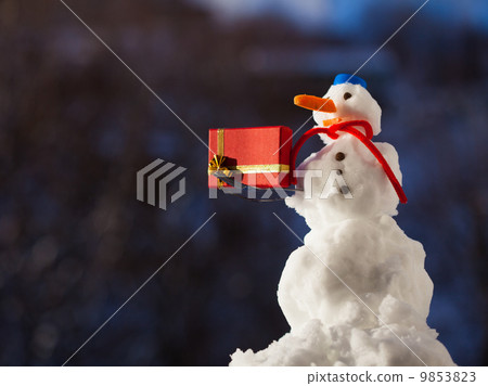 Little happy snowman with christmas gift box outdoor. Winter season. Little happy snowman with christmas gift box outdoor. Winter season. 9853823