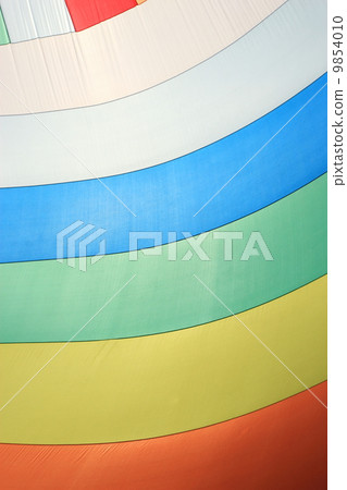 The wind has filled colorful spinnaker sail The wind has filled colorful spinnaker sail 9854010