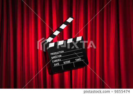 Movie clapper board against curtain 9855474