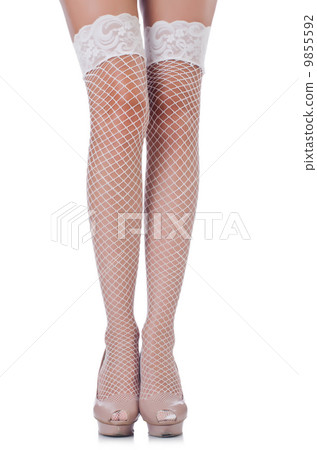 Woman legs with stockings on white Woman legs with stockings on white 9855592