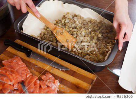 Close up of cooking fish pie with salmon and eggplants Close up of cooking fish pie with salmon and eggplants 9856305