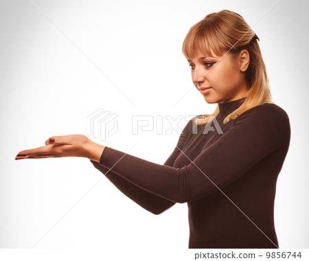 blond woman showing open hand holding black blond woman showing open hand holding black 9856744