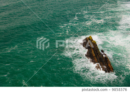 Irish coast. Breaking wave in the sea, Ireland Europe 9858376