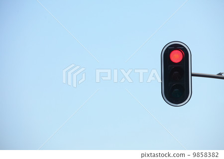 Red traffic lights against blue sky backgrounds 9858382