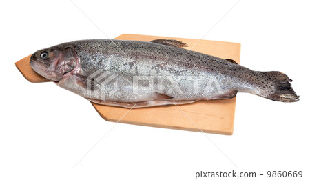 Fresh trout on wooden cutting board, isolated on white backgroun 9860669