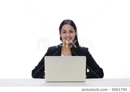 Asia Young Indian Businesswoman Sitting With A Laptop . Asia Young Indian Businesswoman Sitting With A Laptop . 9861790
