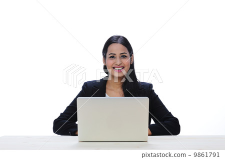 Asia Young Indian Businesswoman Sitting With A Laptop . Asia Young Indian Businesswoman Sitting With A Laptop . 9861791