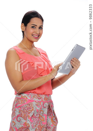 Asia Attractive Young Indian Woman Using Tablet . 9862333