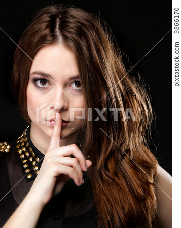 Secret woman. Girl showing hand silence sign Secret woman. Girl showing hand silence sign 9866170