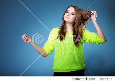 Attractive girl in bright vivid colour sweater Attractive girl in bright vivid colour sweater 9866195