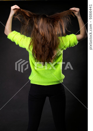 Beautiful female brown long hair back view Beautiful female brown long hair back view 9866441