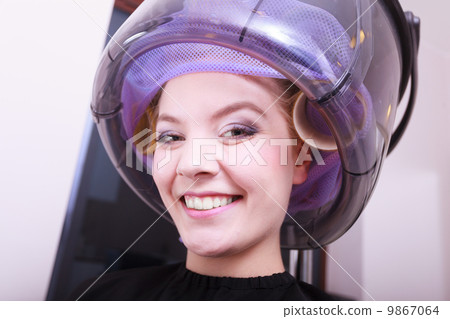 Smiling woman hair rollers curlers hairdryer hairdressing beauty salon Smiling woman hair rollers curlers hairdryer hairdressing beauty salon 9867064