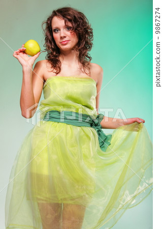Beautiful spring woman with apple. Green concept 9867274