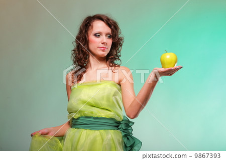 Beautiful spring woman with apple. Green concept Beautiful spring woman with apple. Green concept 9867393