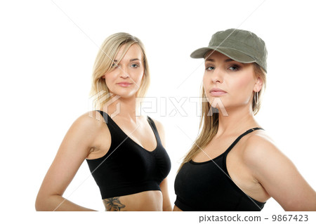 Two sporty women in military caps Two sporty women in military caps 9867423