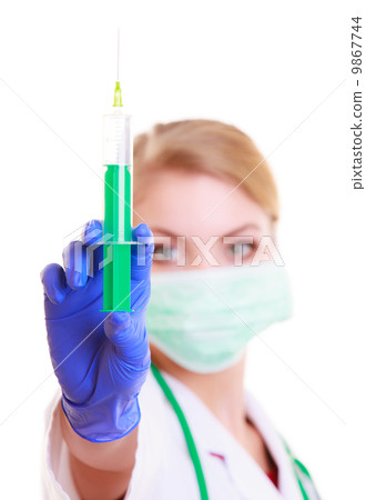 Woman in mask and lab coat. Doctor nurse with syringe. Woman in mask and lab coat. Doctor nurse with syringe. 9867744