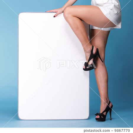 young woman legs white dress and board young woman legs white dress and board 9867770