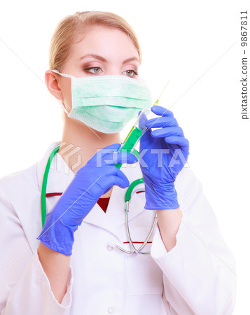 Woman in mask and lab coat. Doctor nurse with syringe. 9867811